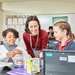 Renbrook School STEM teacher with two students engaged in science fair project